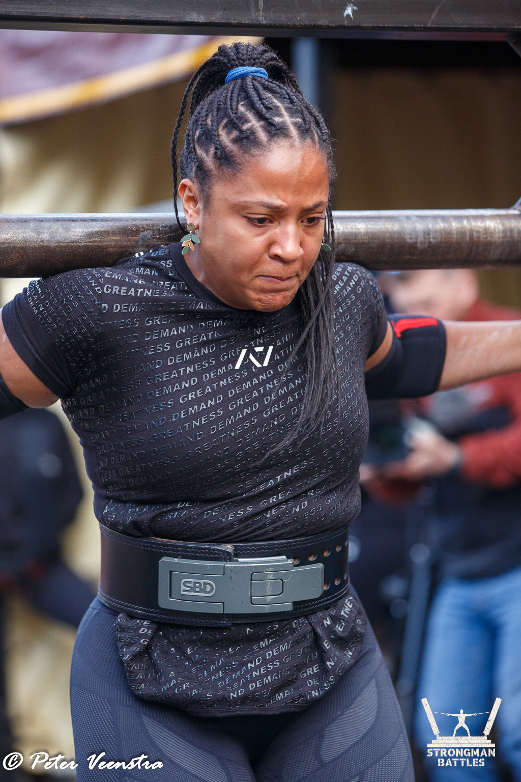An athlete concentrating under a yoke at Natural Strongman in 2025