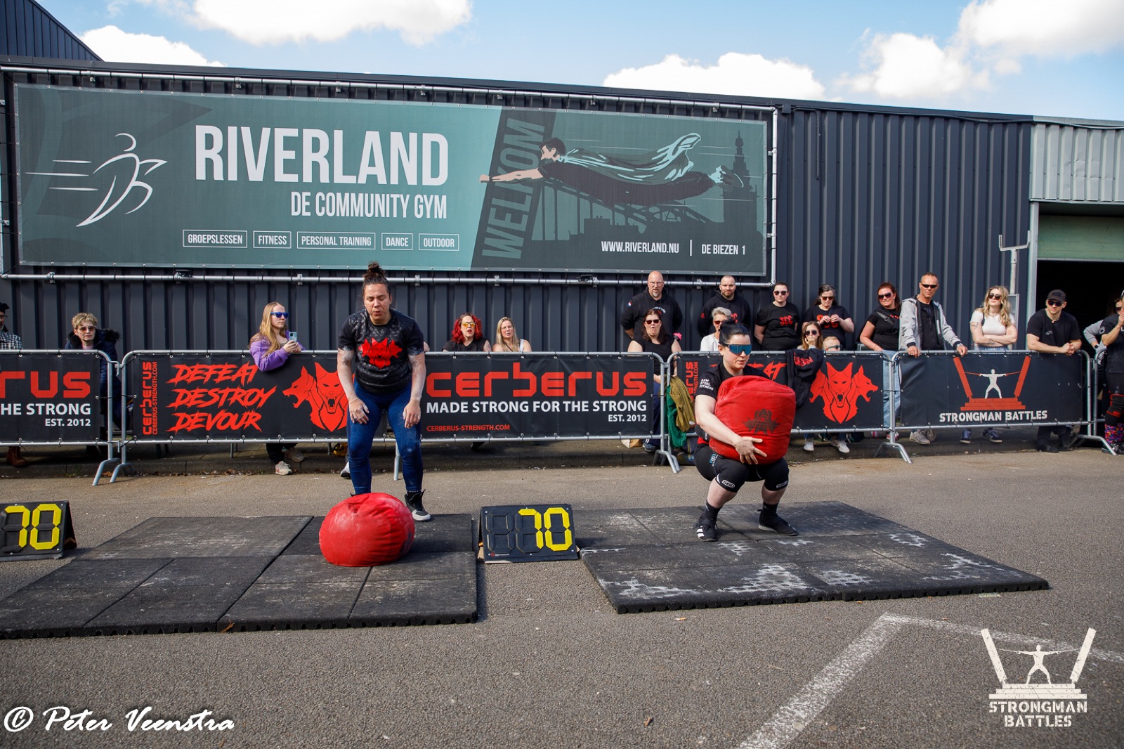 Spectators behind branded arena barriers at the 2025 Natural Strongman Battles in Riverland.