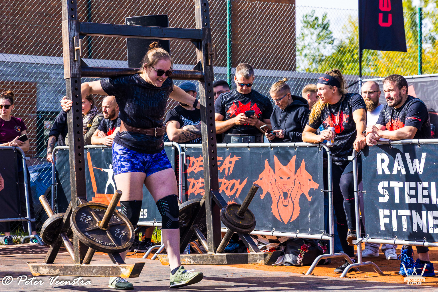 An athlete carrying a yoke at Border Throwdown 2025